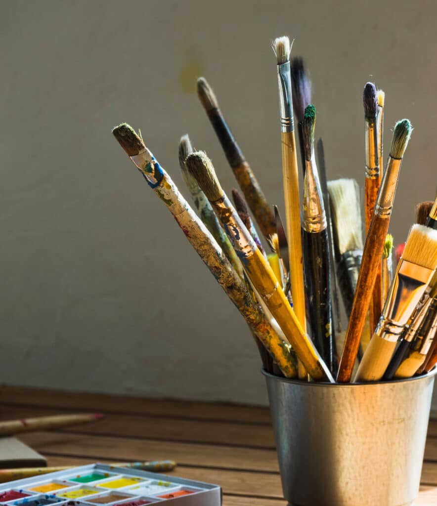metallic can with brushes table